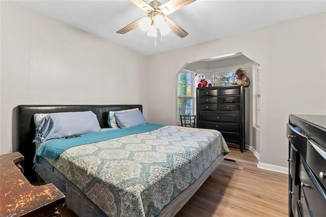 bedroom featuring light hardwood / wood-style flooring and ceiling fan