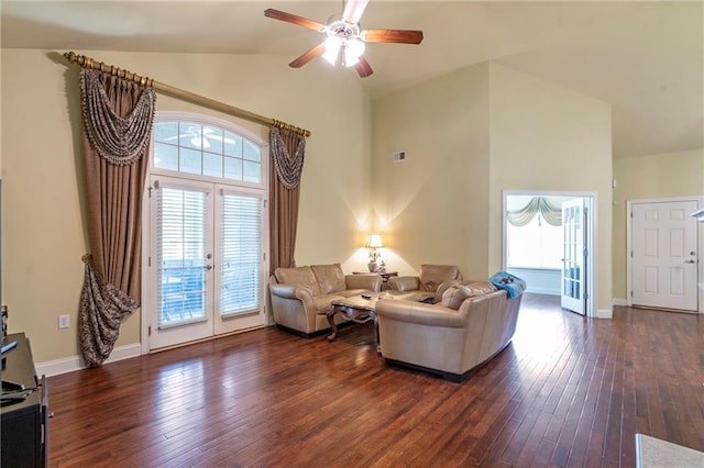 living area with dark wood-style flooring, ceiling fan, french doors, and high vaulted ceiling