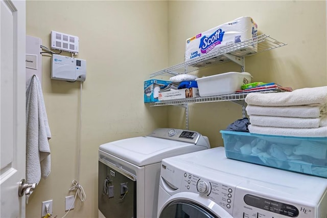 laundry room featuring laundry area and washer and clothes dryer