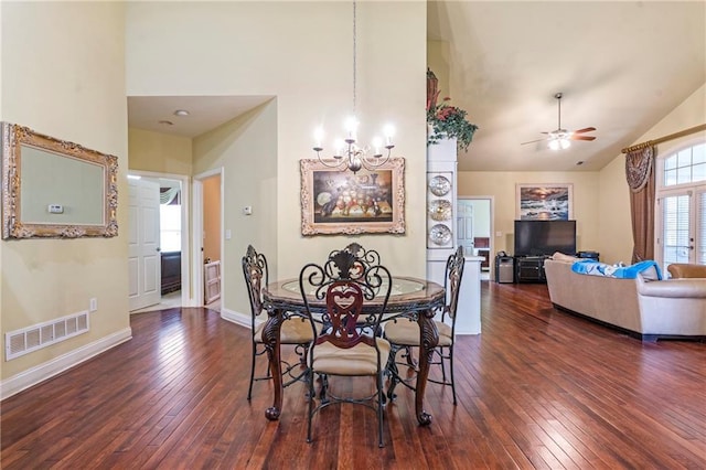 dining space featuring high vaulted ceiling, dark wood-type flooring, and visible vents