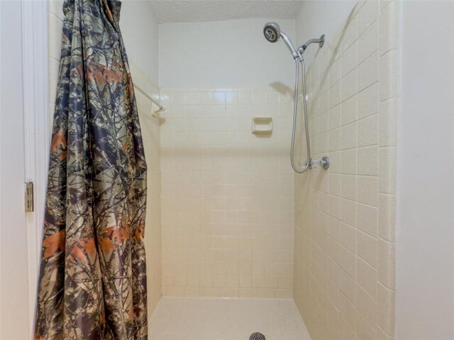 full bath featuring a stall shower
