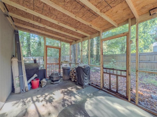 sunroom / solarium featuring healthy amount of natural light