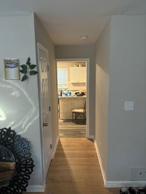 corridor featuring hardwood / wood-style flooring