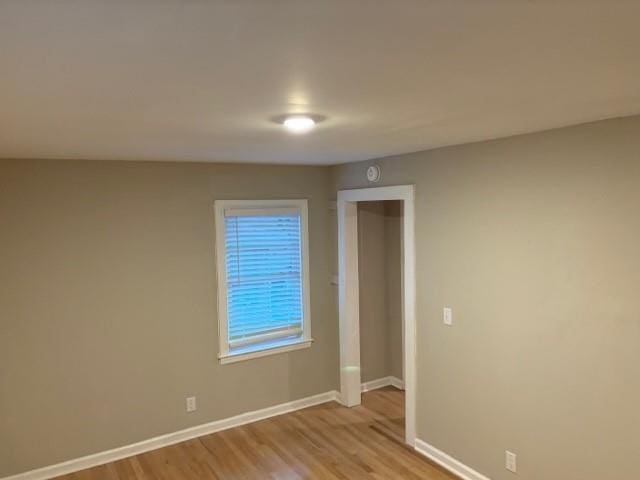 spare room featuring light hardwood / wood-style floors