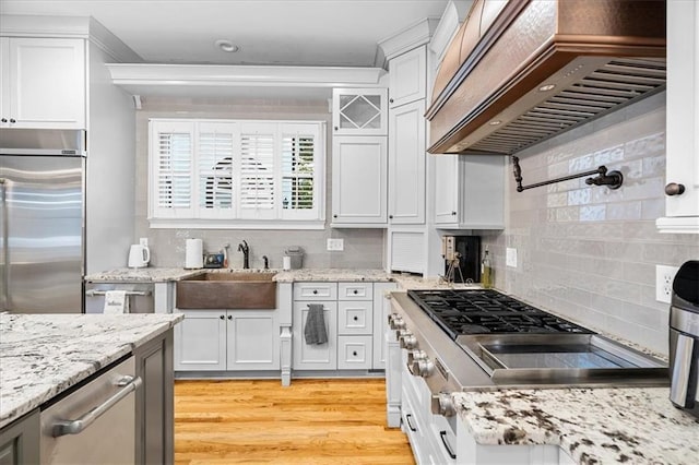 4670 Hamden Forest Dr SW, Atlanta, GA 30331 - kitchen with premium range hood, stainless steel appliances, a sink, and tasteful backsplash