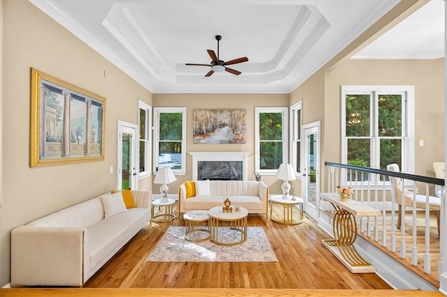 4670 Hamden Forest Dr SW, Atlanta, GA 30331 - living area with ornamental molding, a ceiling fan, plenty of natural light, wood finished floors, and a fireplace