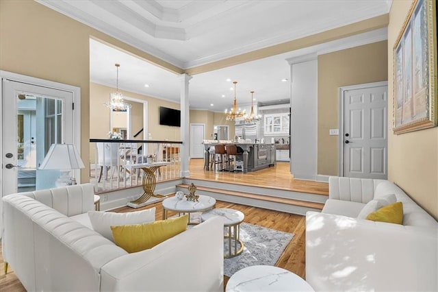 4670 Hamden Forest Dr SW, Atlanta, GA 30331 - living area with a chandelier, light wood-type flooring, ornamental molding, decorative columns, and recessed lighting