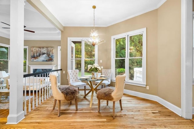 4670 Hamden Forest Dr SW, Atlanta, GA 30331 - dining space featuring light wood-type flooring, a chandelier, ornamental molding, baseboards, and ceiling fan