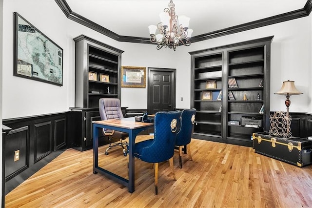4670 Hamden Forest Dr SW, Atlanta, GA 30331 - office featuring ornamental molding, built in shelves, a chandelier, light wood-style floors, and wainscoting