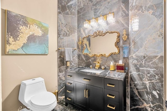 4670 Hamden Forest Dr SW, Atlanta, GA 30331 - bathroom with vanity, marble look tile flooring, and toilet