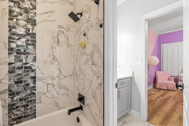 4670 Hamden Forest Dr SW, Atlanta, GA 30331 - bathroom featuring crown molding, vanity, shower / bath combination, marble finish floors, and baseboards