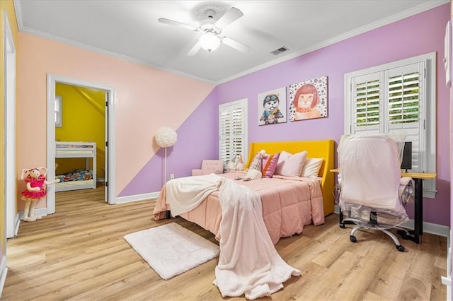 4670 Hamden Forest Dr SW, Atlanta, GA 30331 - bedroom with crown molding, wood finished floors, baseboards, and ceiling fan
