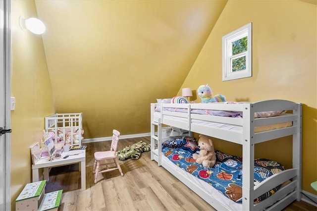 4670 Hamden Forest Dr SW, Atlanta, GA 30331 - bedroom with lofted ceiling and wood finished floors