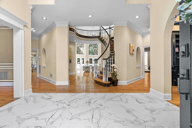 4670 Hamden Forest Dr SW, Atlanta, GA 30331 - entryway featuring arched walkways, crown molding, baseboards, marble finish floors, and recessed lighting