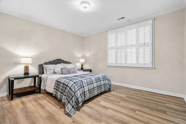 4670 Hamden Forest Dr SW, Atlanta, GA 30331 - bedroom with ornamental molding, baseboards, and wood finished floors