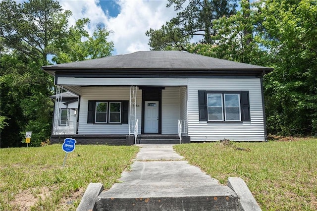 1156 Clinton Rd, Macon, GA 31211 - view of front of home featuring a front yard and covered porch