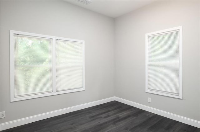 1156 Clinton Rd, Macon, GA 31211 - empty room with dark wood-style floors and baseboards
