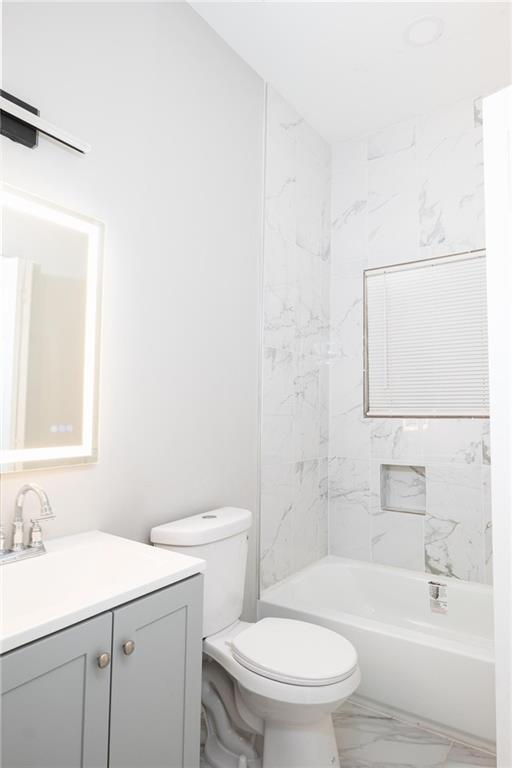1156 Clinton Rd, Macon, GA 31211 - bathroom with marble finish flooring, vanity, toilet, and shower / bath combination