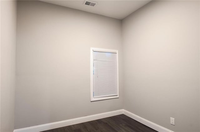 1156 Clinton Rd, Macon, GA 31211 - spare room featuring baseboards and dark wood-style flooring