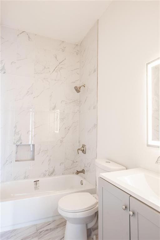 1156 Clinton Rd, Macon, GA 31211 - full bath featuring vanity, toilet, marble finish floors, and bathing tub / shower combination