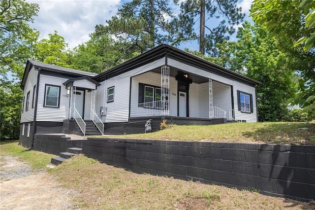 1156 Clinton Rd, Macon, GA 31211 - view of front of property featuring covered porch and a front lawn