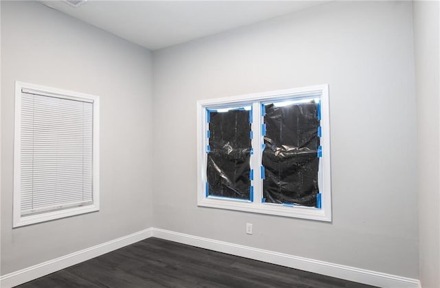 1156 Clinton Rd, Macon, GA 31211 - spare room featuring baseboards and dark wood-style flooring