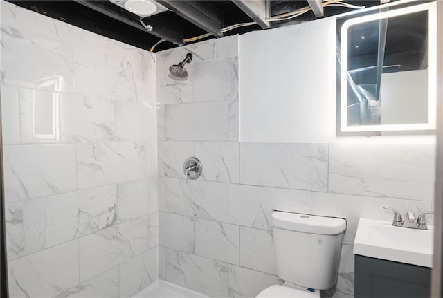 1156 Clinton Rd, Macon, GA 31211 - bathroom featuring vanity, a tile shower, toilet, and tile walls
