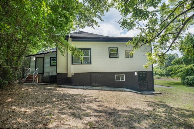 1156 Clinton Rd, Macon, GA 31211 - back of property featuring central AC unit and brick siding