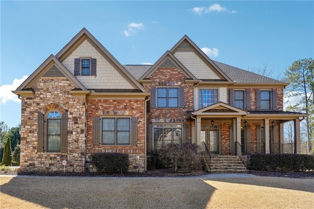 craftsman-style house with brick siding