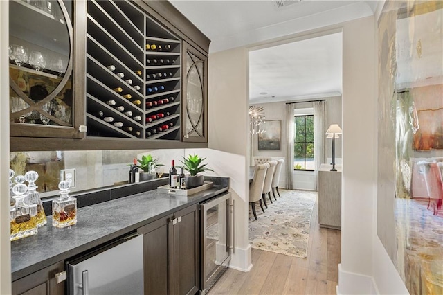 284 Hook St, Alpharetta, GA 30009 - indoor wet bar featuring wine cooler, light wood-type flooring, refrigerator, and baseboards
