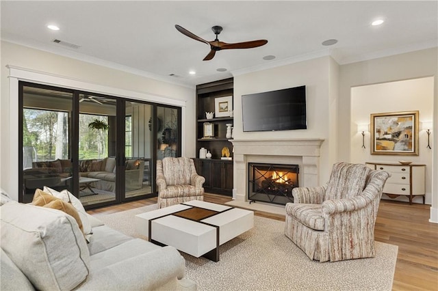 284 Hook St, Alpharetta, GA 30009 - living room featuring a ceiling fan, crown molding, wood finished floors, a lit fireplace, and recessed lighting
