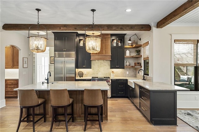 284 Hook St, Alpharetta, GA 30009 - kitchen with premium appliances, light wood-type flooring, a sink, beam ceiling, and recessed lighting