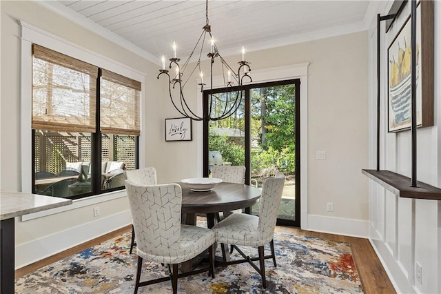 284 Hook St, Alpharetta, GA 30009 - dining space with a chandelier, dark wood-type flooring, crown molding, and baseboards