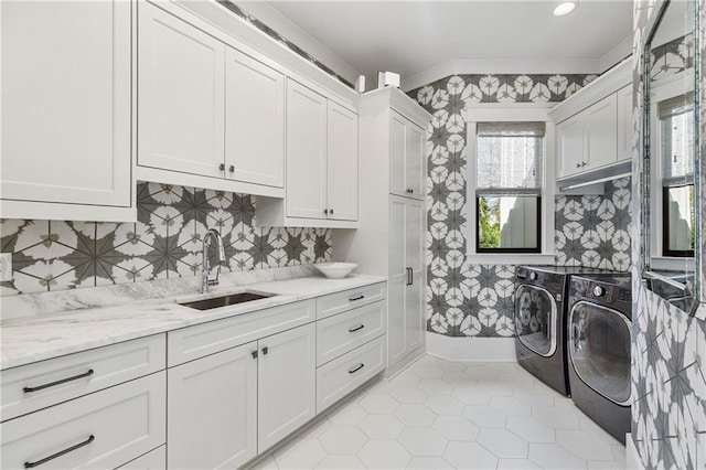 284 Hook St, Alpharetta, GA 30009 - laundry room with cabinet space, washing machine and dryer, wallpapered walls, and light tile patterned floors