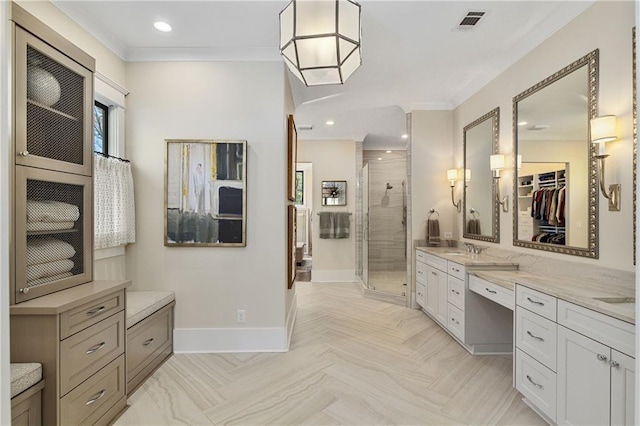284 Hook St, Alpharetta, GA 30009 - bathroom featuring a shower stall, baseboards, ornamental molding, vanity, and a walk in closet