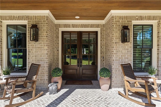 284 Hook St, Alpharetta, GA 30009 - doorway to property featuring french doors, brick siding, and a porch