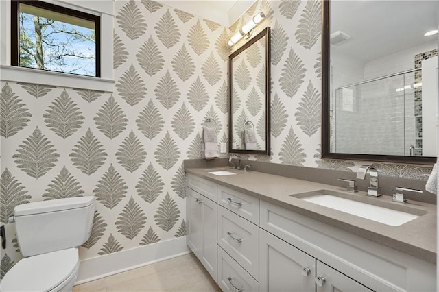 284 Hook St, Alpharetta, GA 30009 - bathroom with wallpapered walls, baseboards, double vanity, toilet, and a stall shower