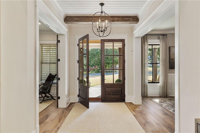 284 Hook St, Alpharetta, GA 30009 - entrance foyer featuring light wood-style floors, a chandelier, beam ceiling, baseboards, and crown molding