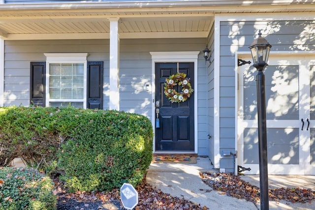 doorway to property with covered porch