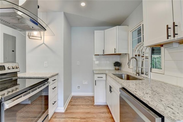 3991 Adamsville Dr SW, Atlanta, GA 30331 - kitchen featuring stainless steel appliances, wall chimney range hood, light wood-style flooring, backsplash, and light stone counters