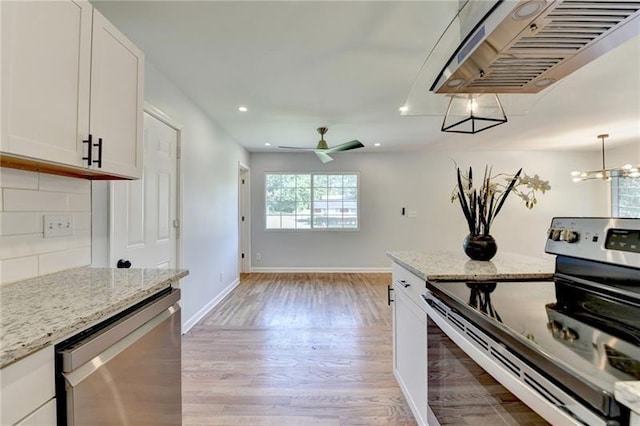 3991 Adamsville Dr SW, Atlanta, GA 30331 - kitchen with stainless steel appliances, light wood-style floors, recessed lighting, white cabinetry, and tasteful backsplash