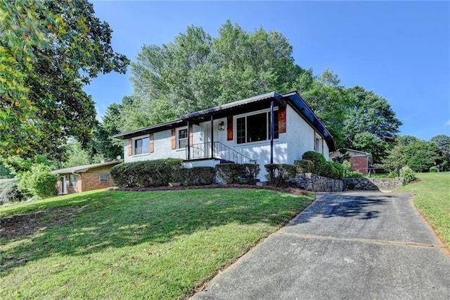 3991 Adamsville Dr SW, Atlanta, GA 30331 - ranch-style home featuring a front lawn and concrete driveway