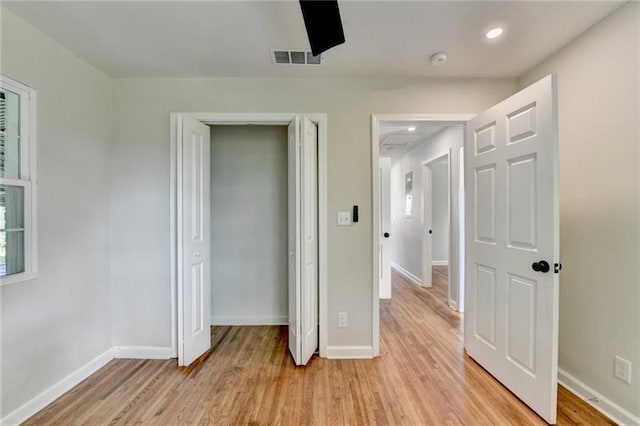 3991 Adamsville Dr SW, Atlanta, GA 30331 - unfurnished bedroom with light wood-type flooring and a closet