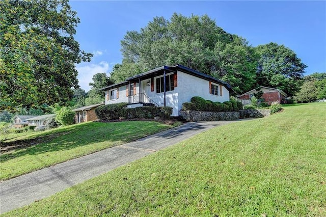 3991 Adamsville Dr SW, Atlanta, GA 30331 - view of front of house with a front yard and stucco siding