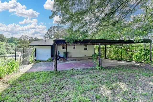 3991 Adamsville Dr SW, Atlanta, GA 30331 - back of property with a carport and a patio
