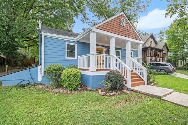 view of front facade with a porch and a front yard