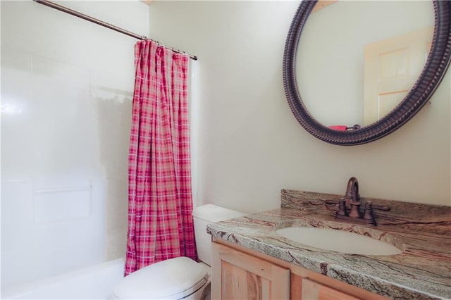 bathroom featuring vanity, toilet, and shower / bathtub combination with curtain