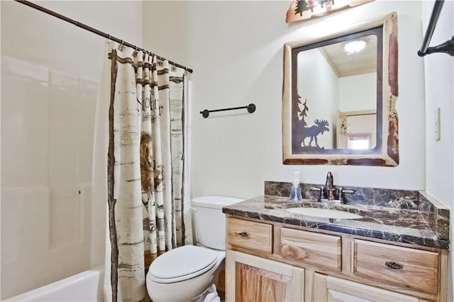 bathroom featuring shower / bath combo, vanity, and toilet