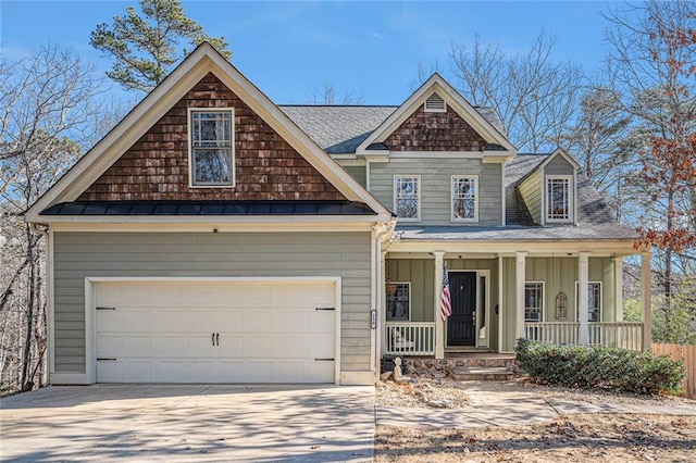 view of front facade with a porch and a garage