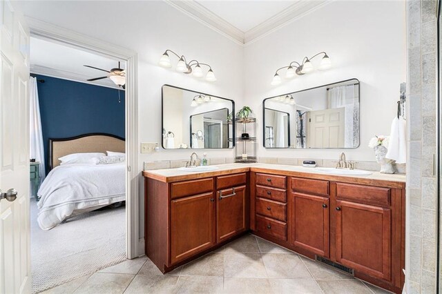 bathroom featuring ceiling fan, ornamental molding, tile patterned flooring, and vanity